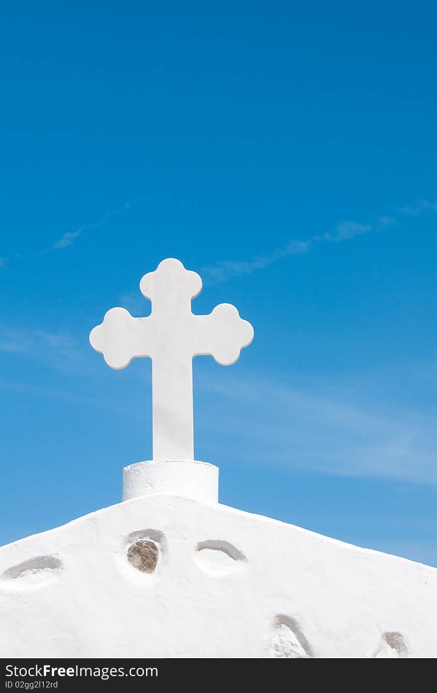 Greek church in santorini greece with a cross