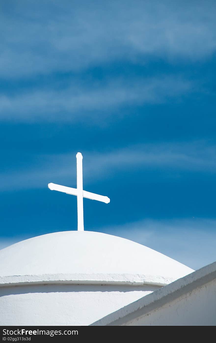 Greek church in santorini greece with a cross