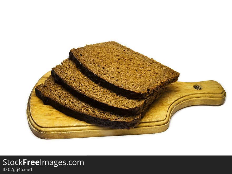 Autentic Lithuanian Rye - bread on old cutting board. Autentic Lithuanian Rye - bread on old cutting board