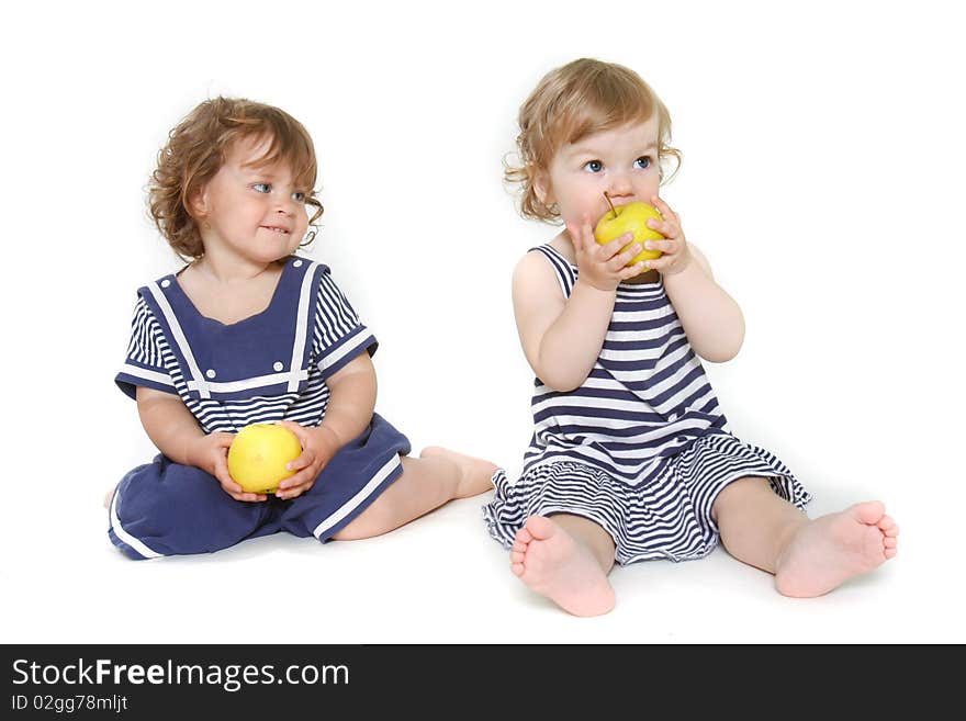 Two adorable toddler girls with green apples. Two adorable toddler girls with green apples