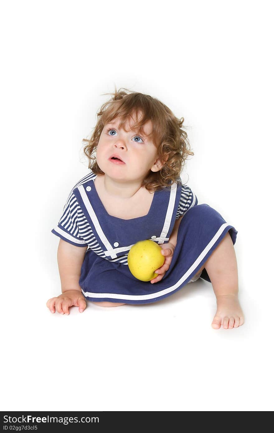 Adorable toddler girl with green apple