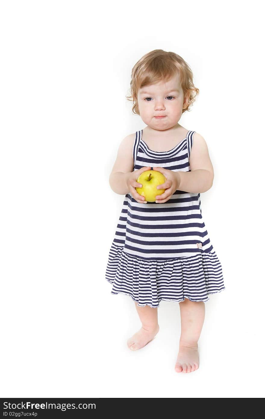 Adorable toddler girl with green apple over white