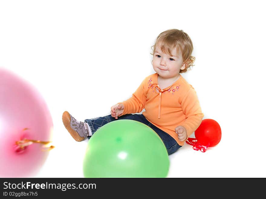 Cute toddler girl with colorful balloons