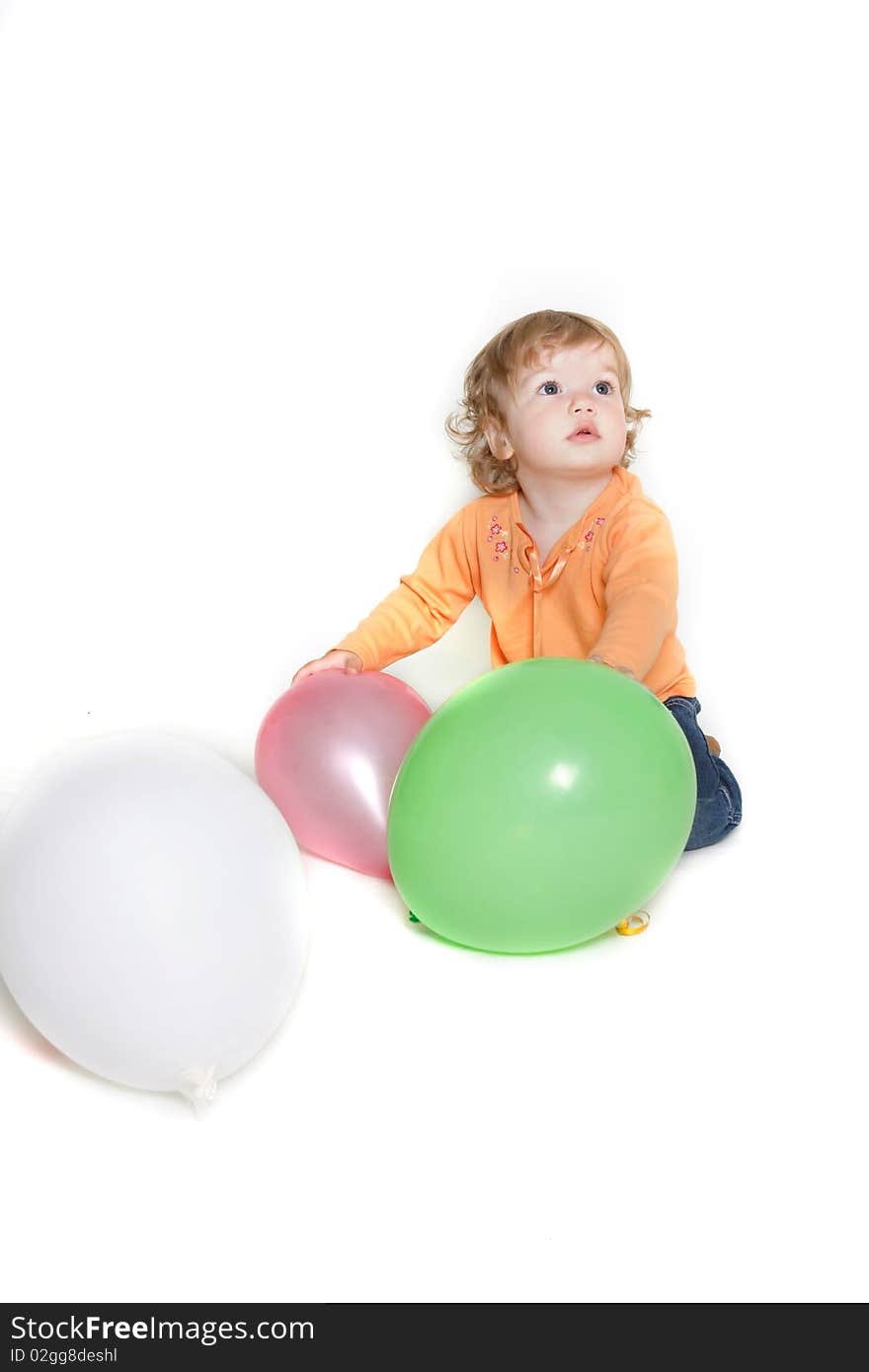 Cute toddler girl with balloons over white