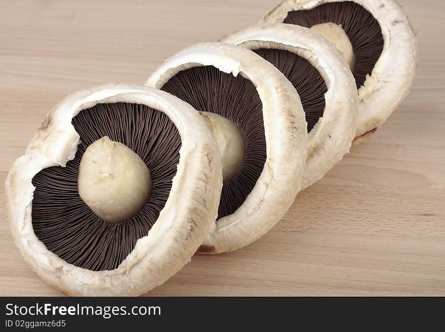 Large mushrooms closeup on on wooden surface