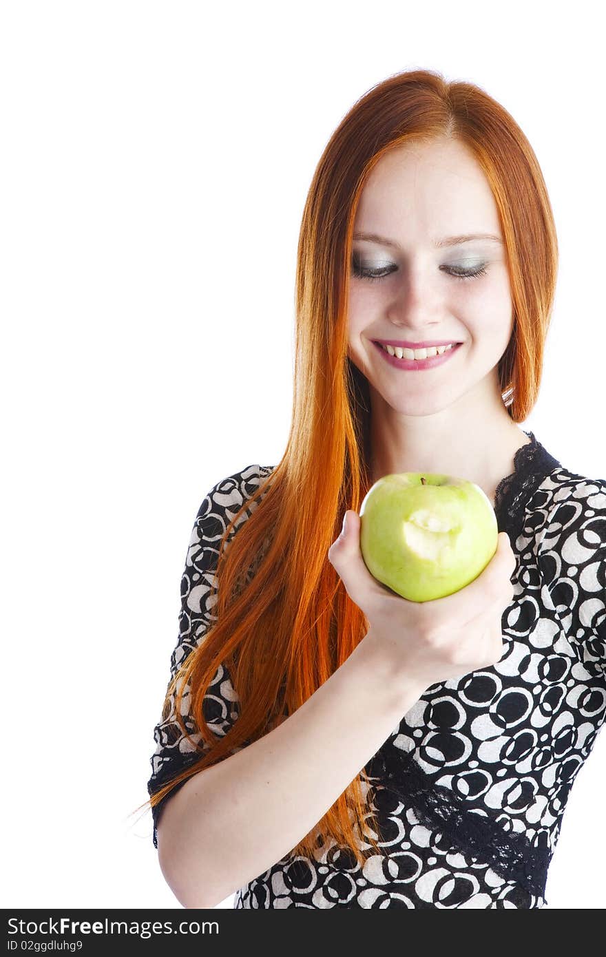 Green tasty apple in hands of the girl