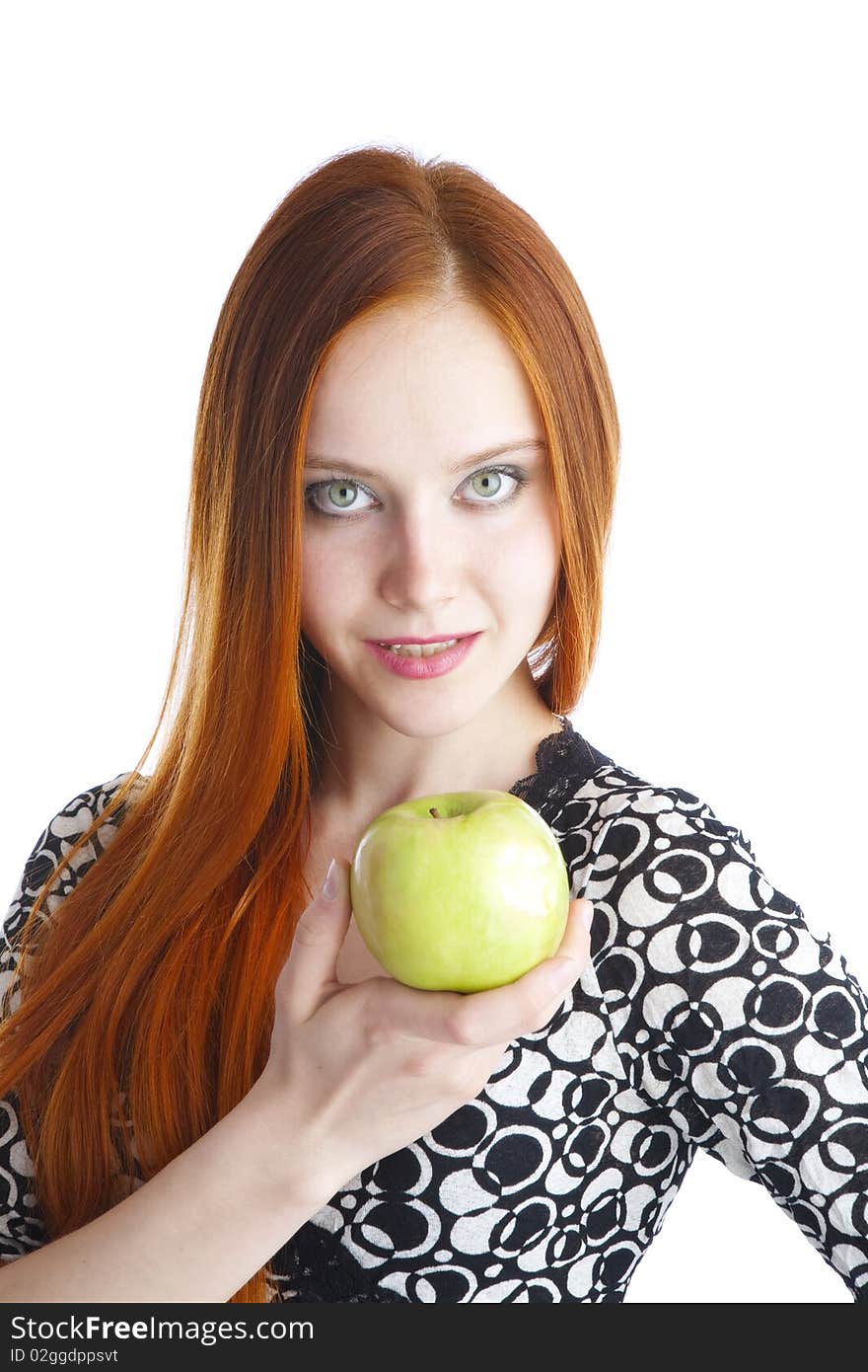 Green tasty apple in hands of the girl