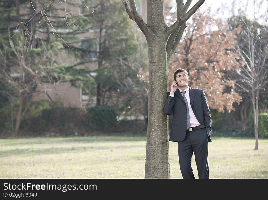 Businessman on the phone outdoors