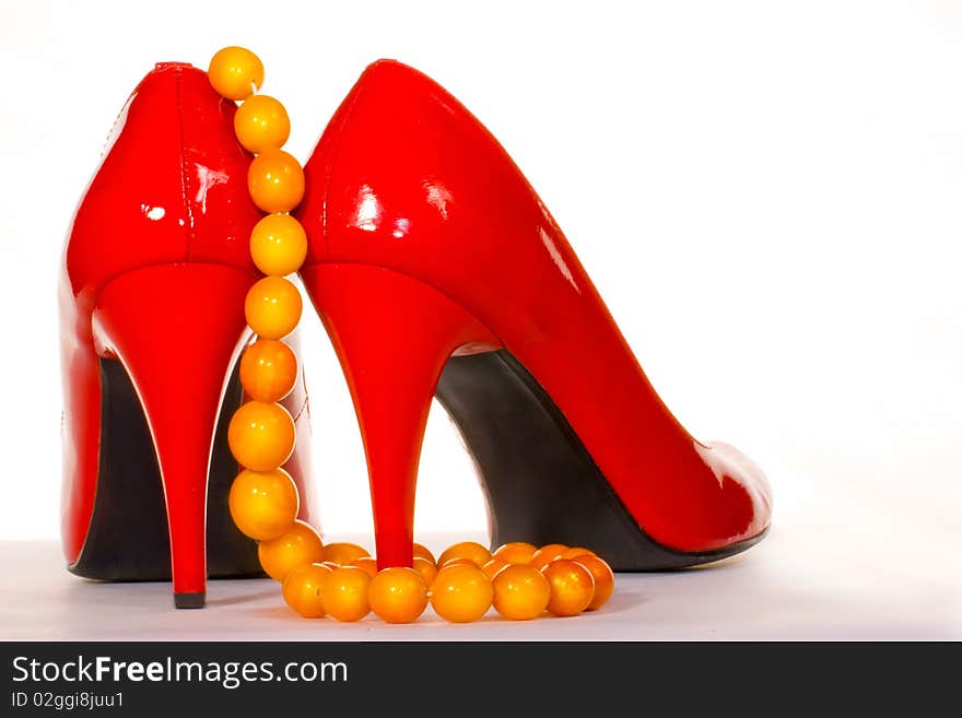 Red shoes and amber collar or chaplet