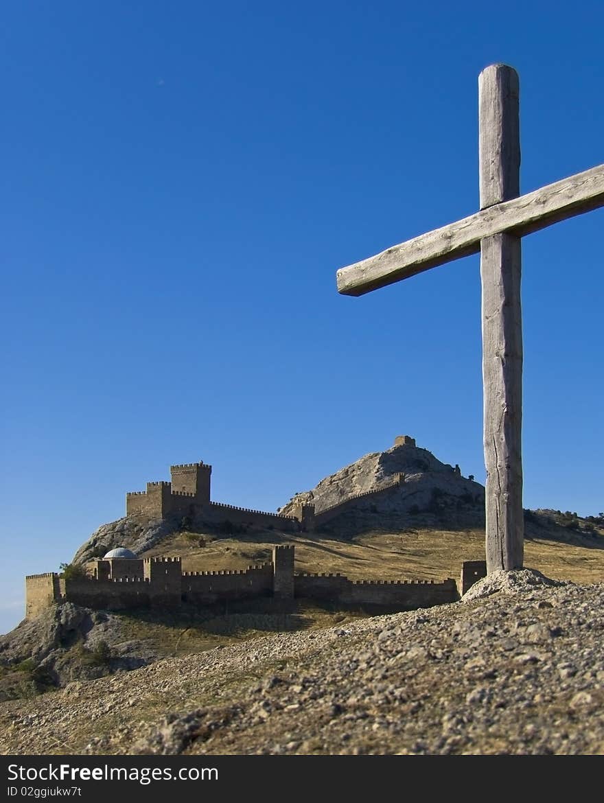 Fortress in Sudak on the background of blue sky.