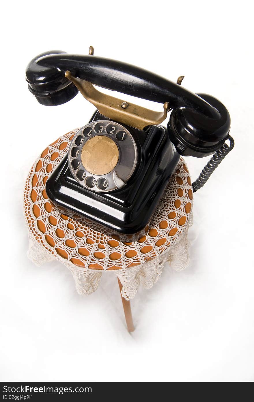 Old-fashioned phone isolated on a white background. Old-fashioned phone isolated on a white background.