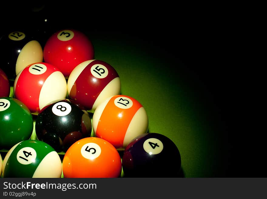 Poolballs in green background shot in studio. Poolballs in green background shot in studio