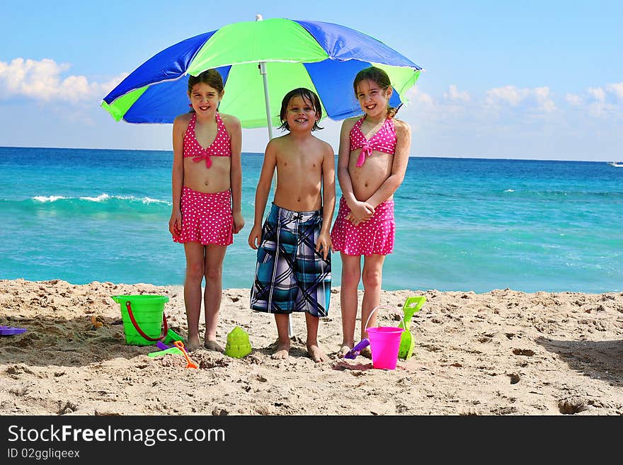 Shot of little children at the beach