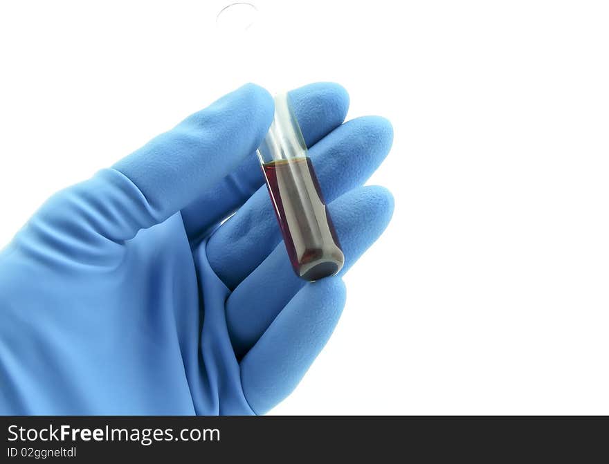 Vial with chemical in hand, laboratory workers