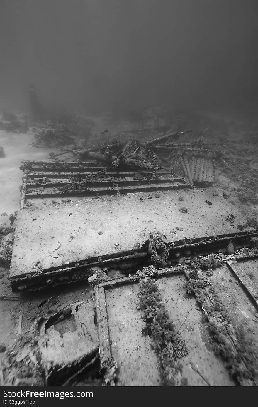 Ship wreckage on the ocean floor.