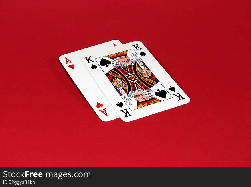 Two playing cards placed on a red background. Two playing cards placed on a red background