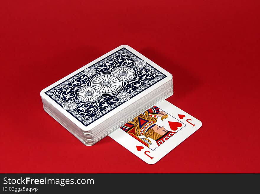 Distribution of playing cards on a red background. Distribution of playing cards on a red background