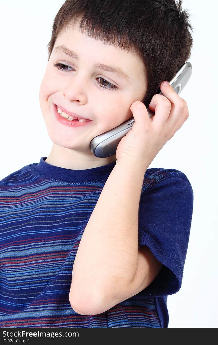 Small boy calling from mobile phone to friend on white background. Small boy calling from mobile phone to friend on white background