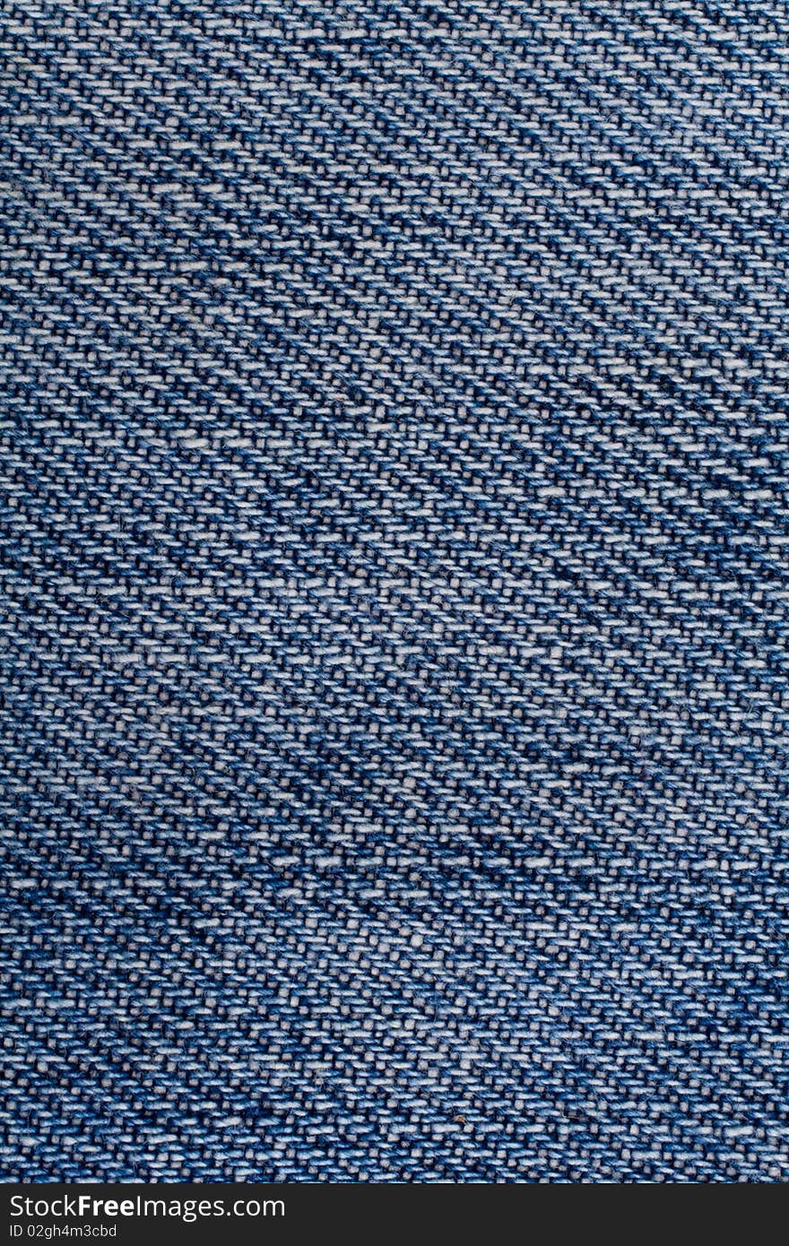 Blue jeans material close-up. Blue jeans material close-up