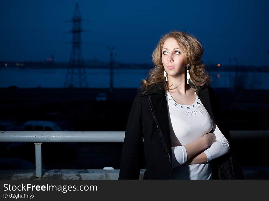 Evening walk on the balcony overlooking the lake at night. Evening walk on the balcony overlooking the lake at night