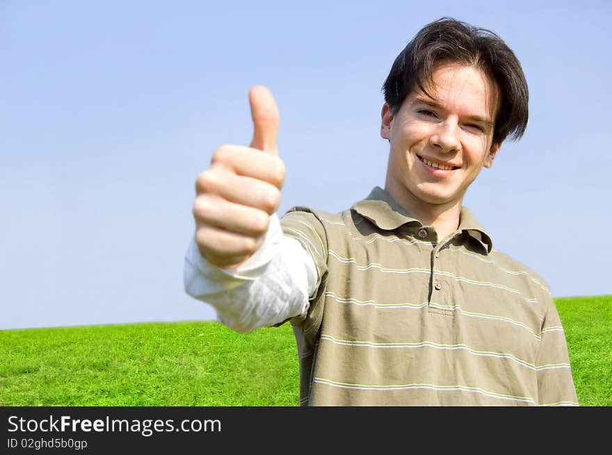 Gesture conceptual image. Teenager giving the thumbs-up sign.