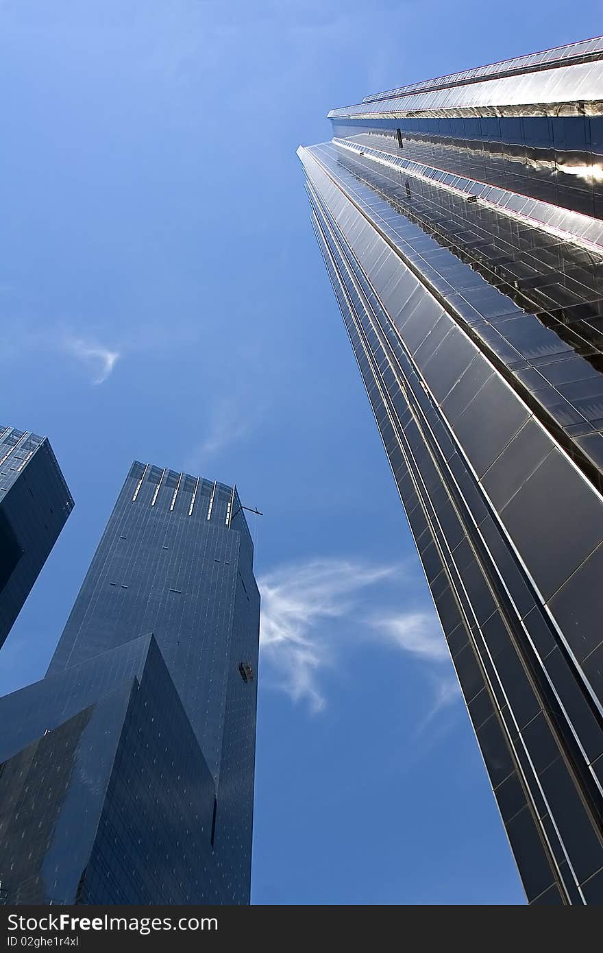 Two High-rise buildings under blue sky in New York city. Two High-rise buildings under blue sky in New York city.