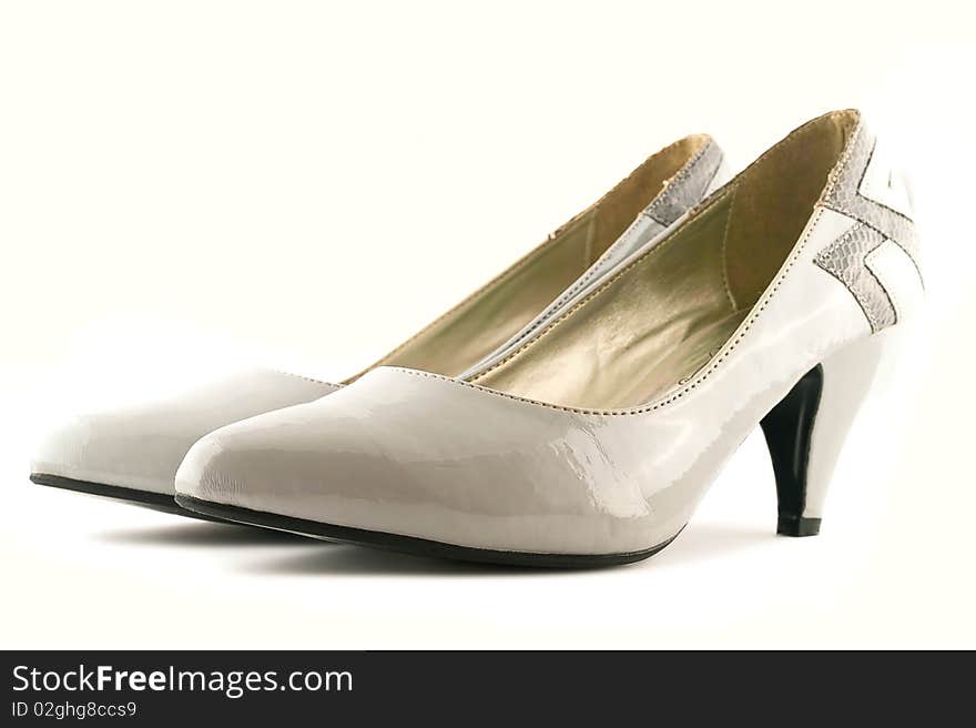 White female shoes on a white background