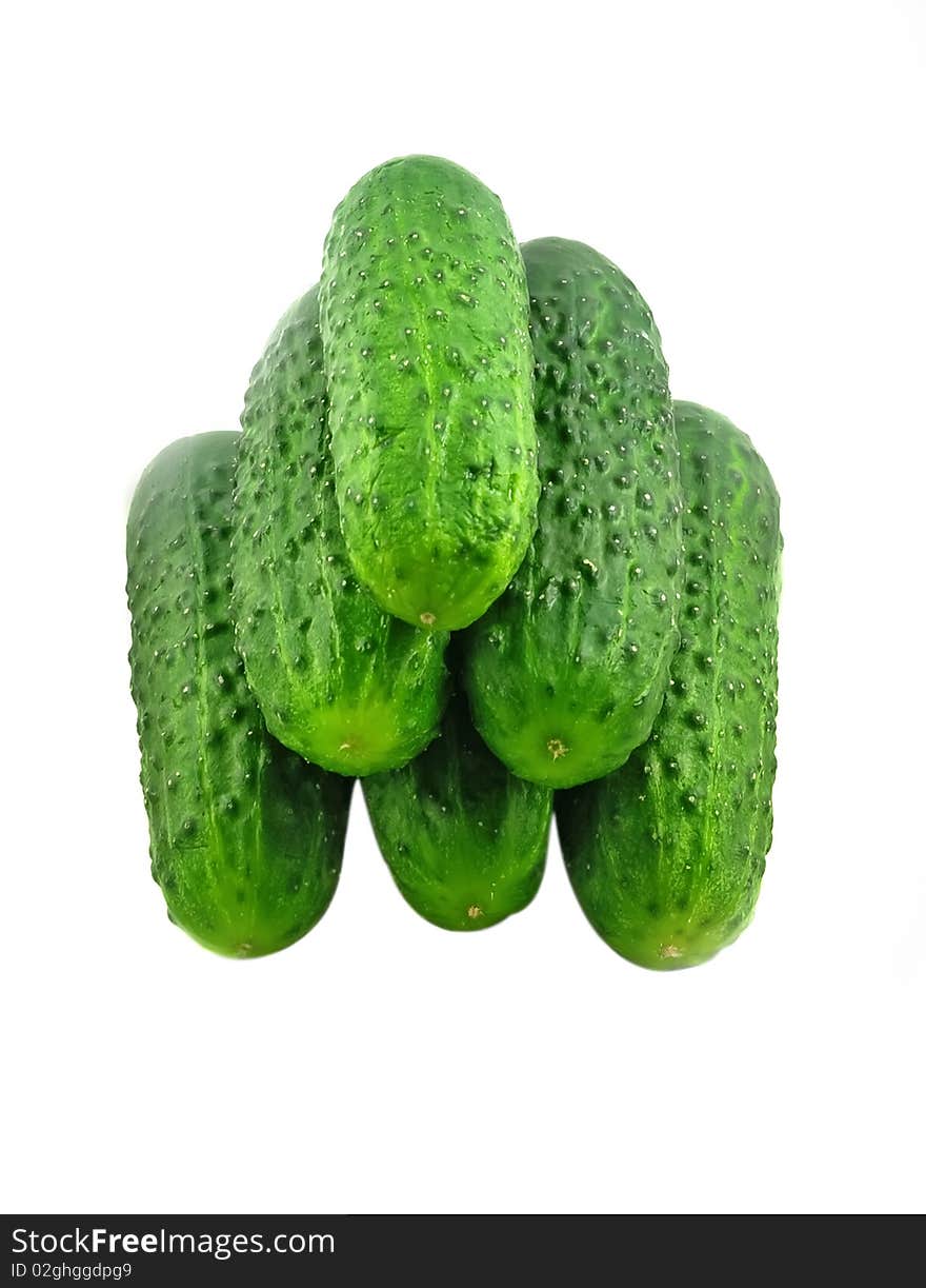 Fresh cucumbers in a pile isolated on the white