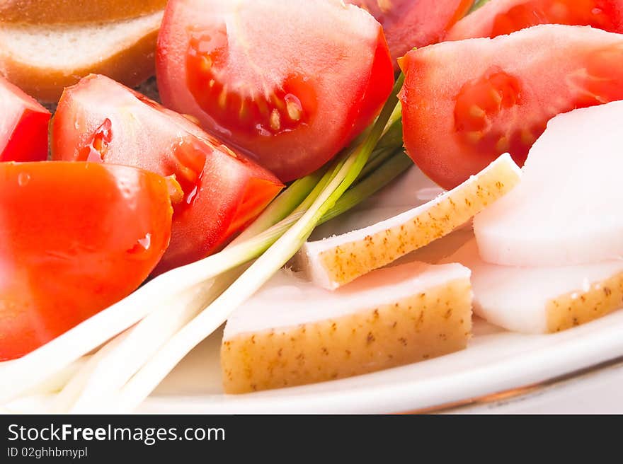 Fresh tomato and fat isolated over white. Fresh tomato and fat isolated over white