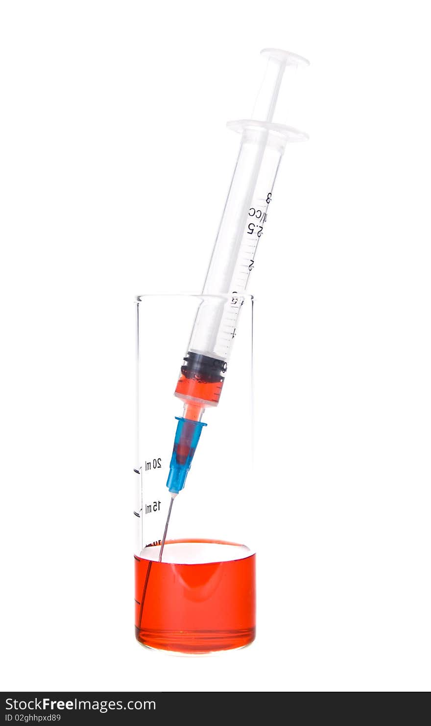 Tubes and syringe with red liquid on a white background. Tubes and syringe with red liquid on a white background