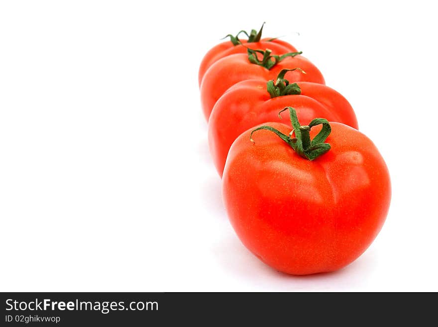 Four tomatoes isolated on the white background