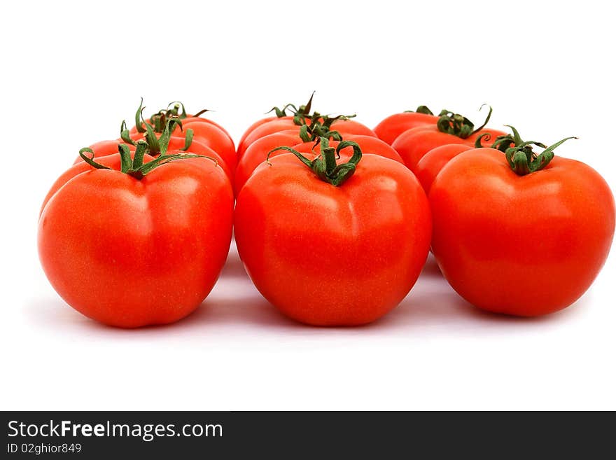 A few red tomatoes isolated on white. A few red tomatoes isolated on white