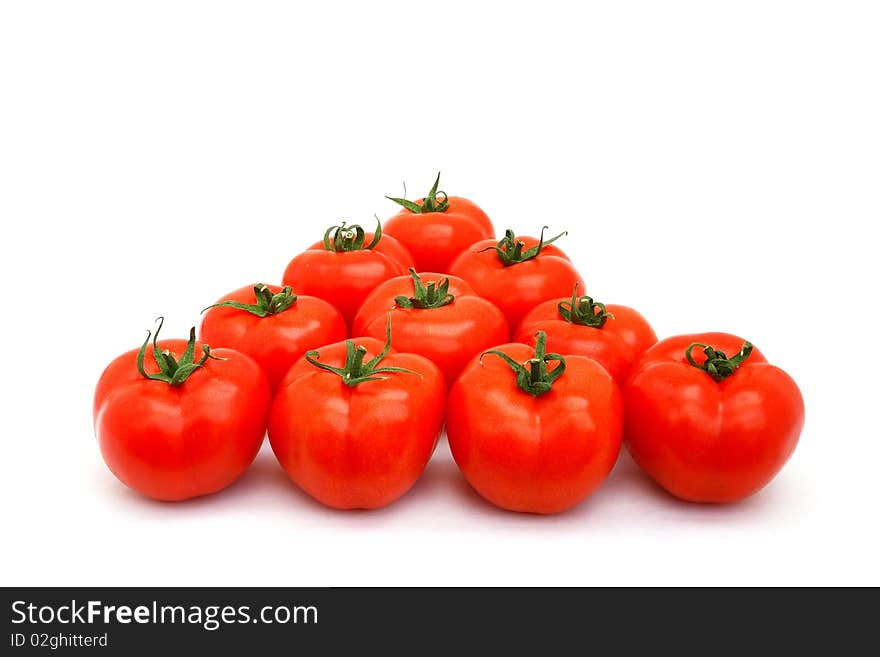 A few red tomatoes isolated on white. A few red tomatoes isolated on white