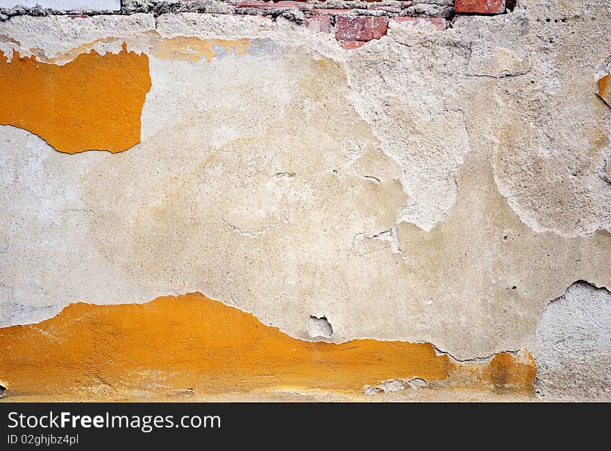 Fragment of tumbledown plastered brick wall. Fragment of tumbledown plastered brick wall