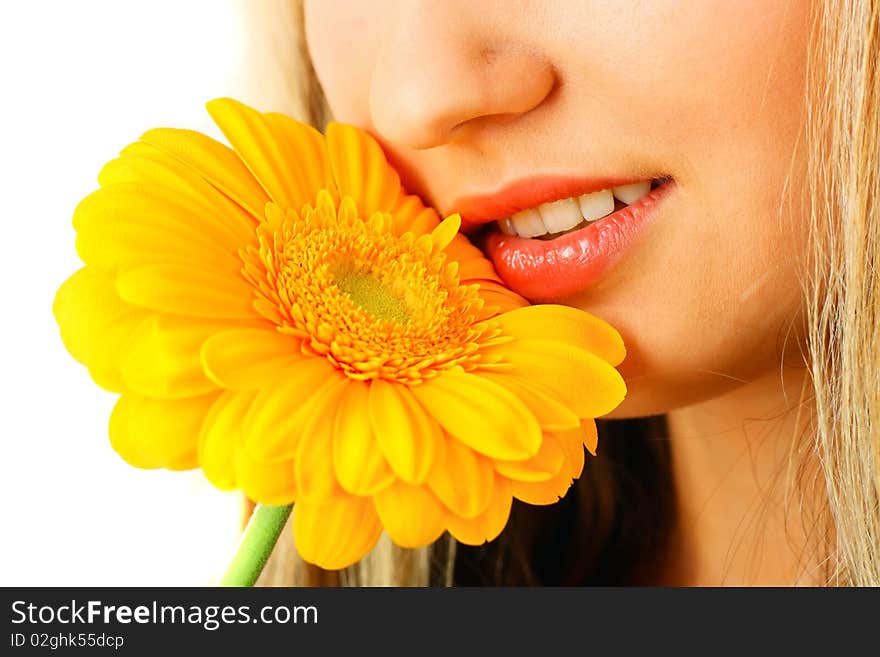 Young woman with a flower. Over white background