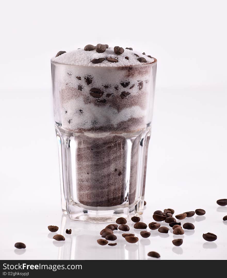 Studio shot of a glass of latte macchiato on white background. Studio shot of a glass of latte macchiato on white background