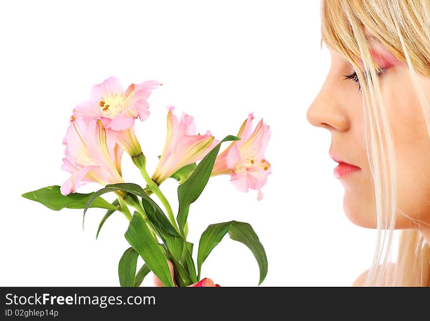 Portrait of a woman holding pink flowers