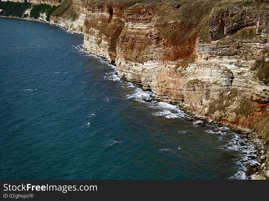 Waves hit the rocky beach in