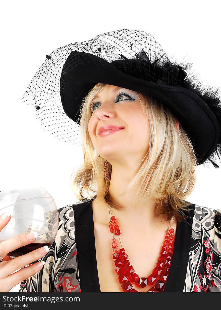 Beautiful blond woman in fashion dress and old stile hat with glass of wine isolated on the white. Studio shoot for actress in retro stile. Beautiful blond woman in fashion dress and old stile hat with glass of wine isolated on the white. Studio shoot for actress in retro stile.