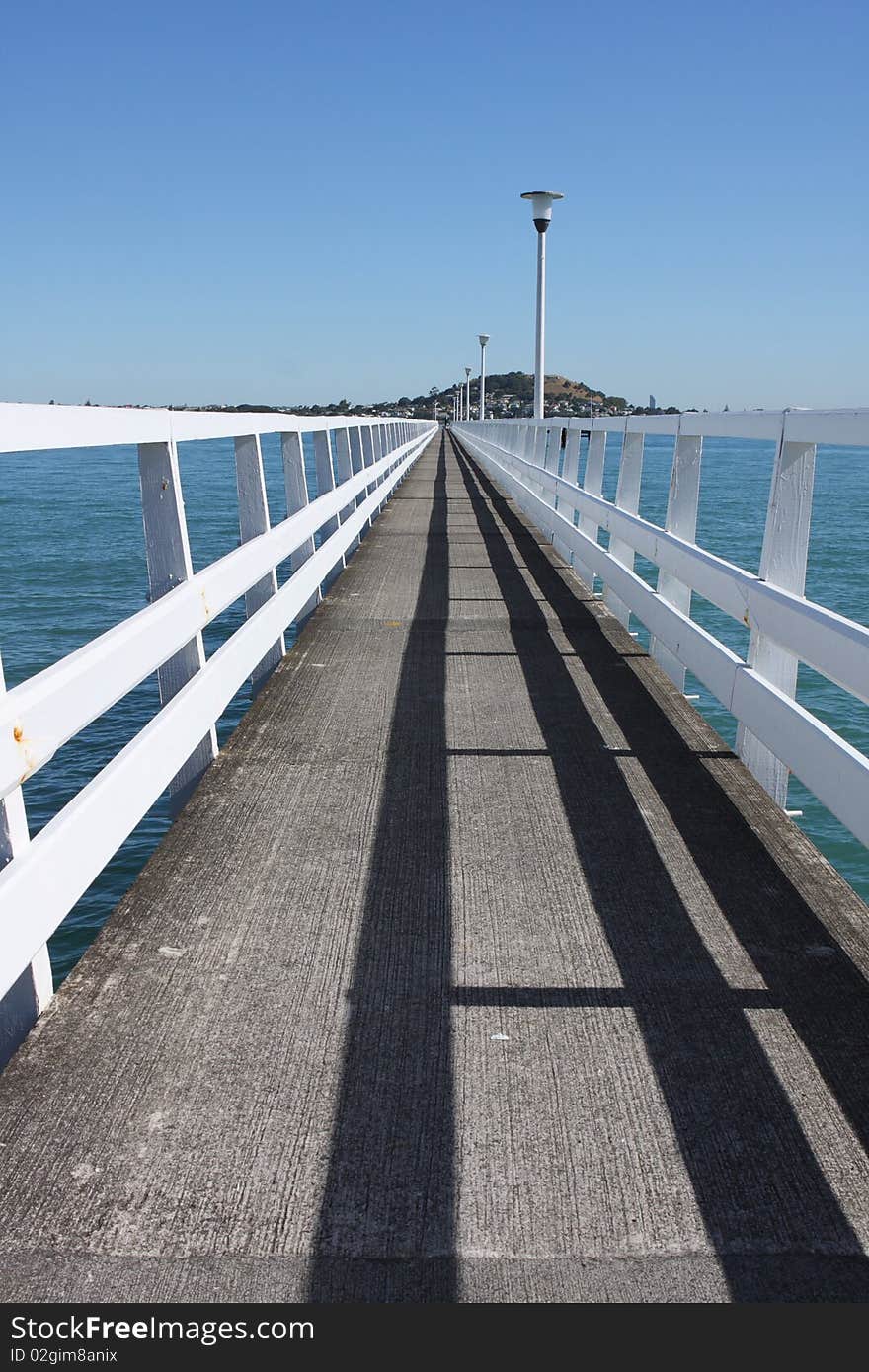 Long deserted jetty into Auckland Harbour