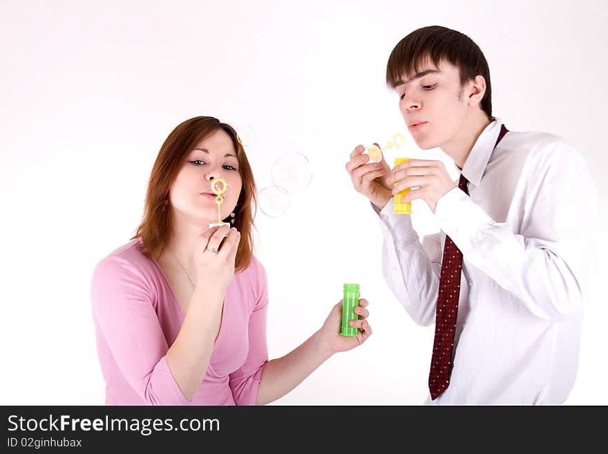 Romantic couple blowing soap bubbles