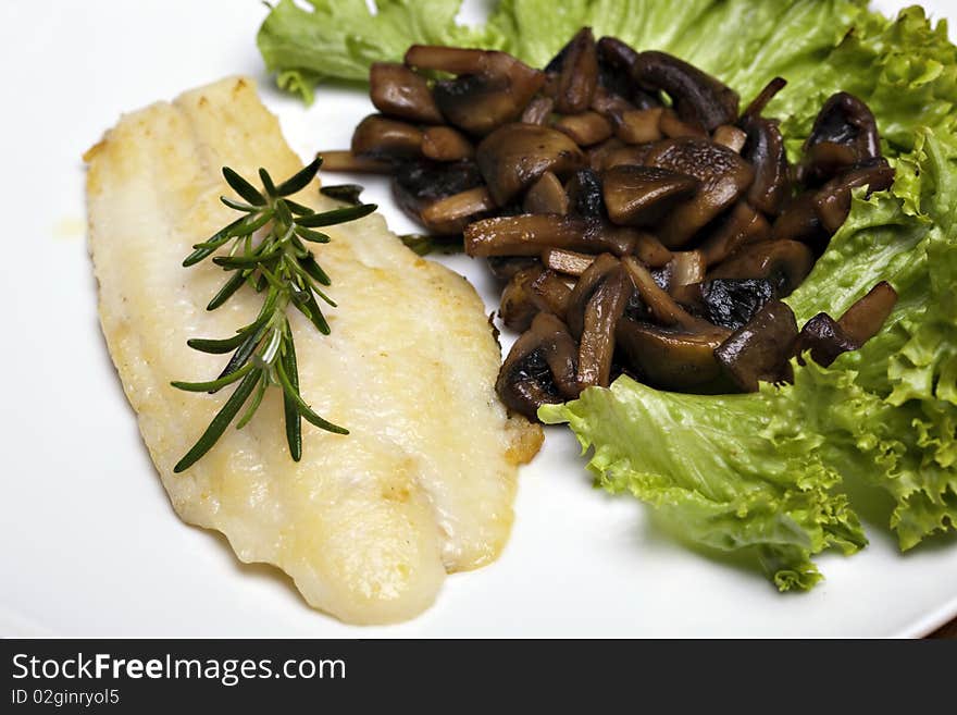 Grilled sole fish with mushrooms and herb