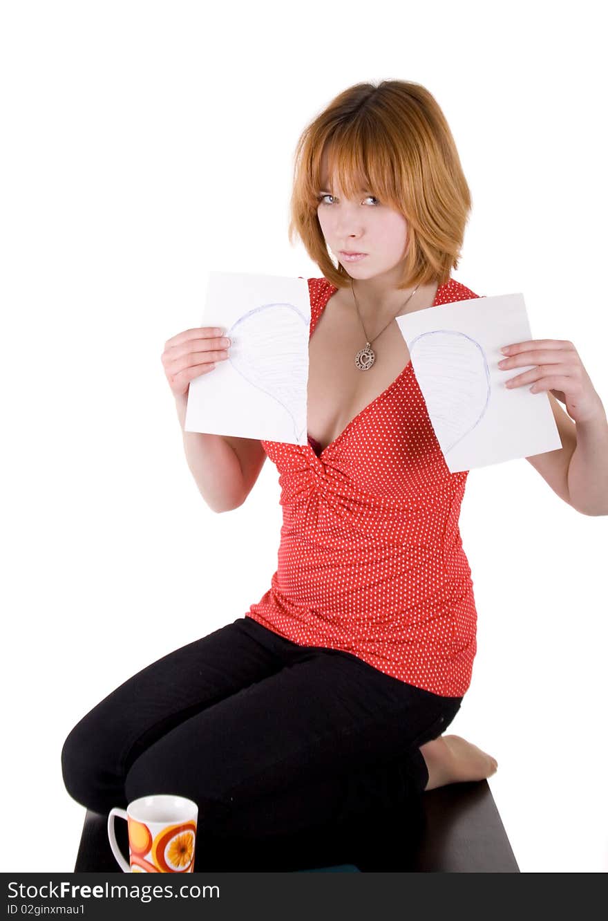 Pretty girl tearing list of paper with heart on it