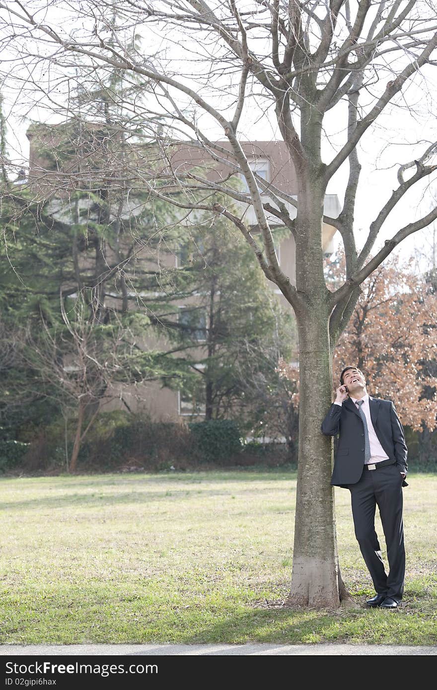 Businessman on the phone outdoors