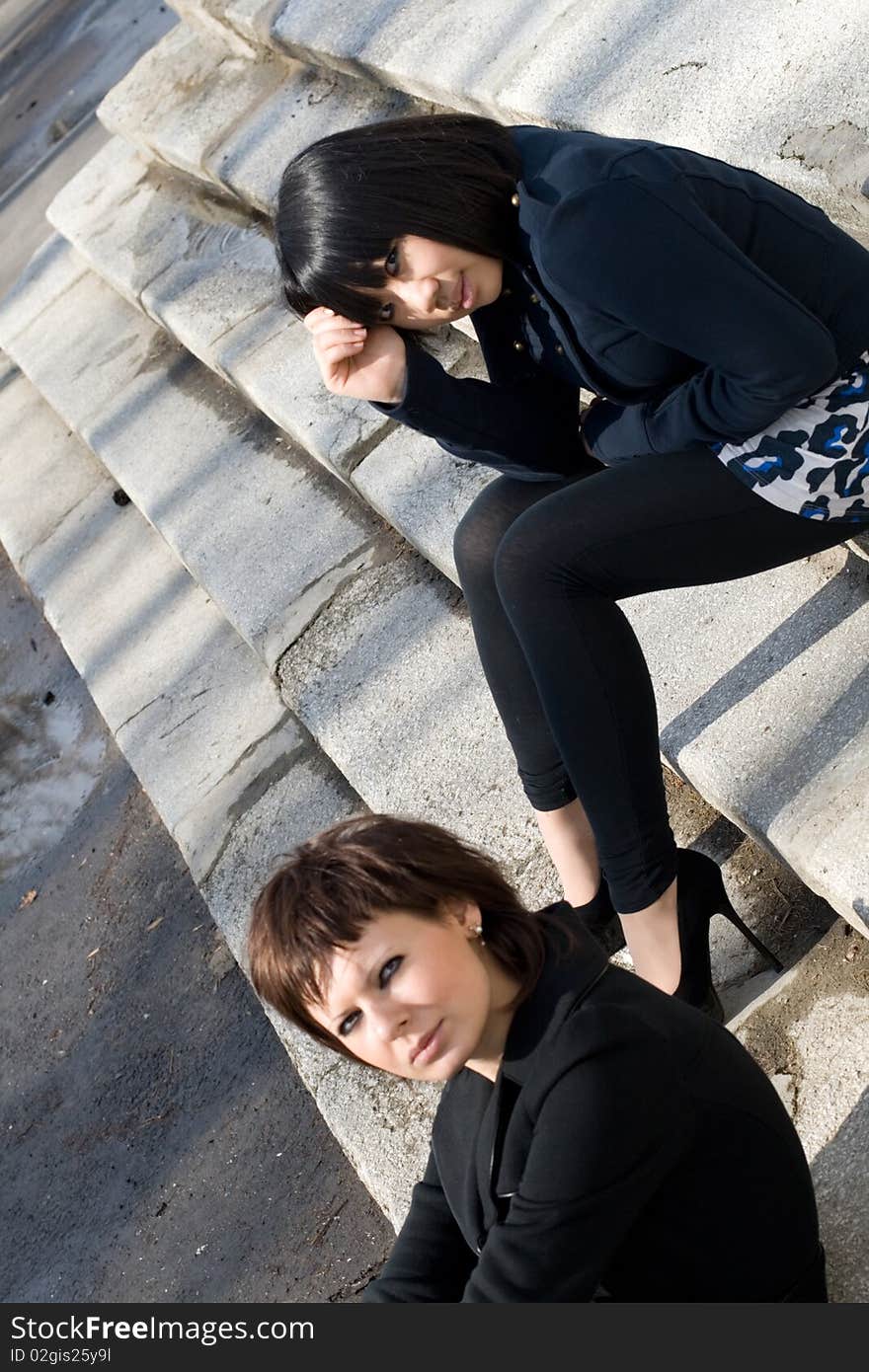 Two female friends walking outdoor