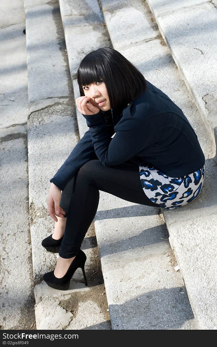 Girl Sitting On Stairs