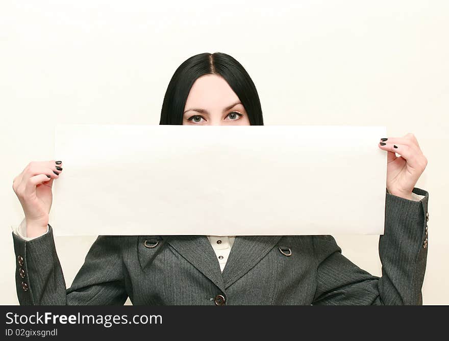 Young business woman holding empty large white billboard. Young business woman holding empty large white billboard