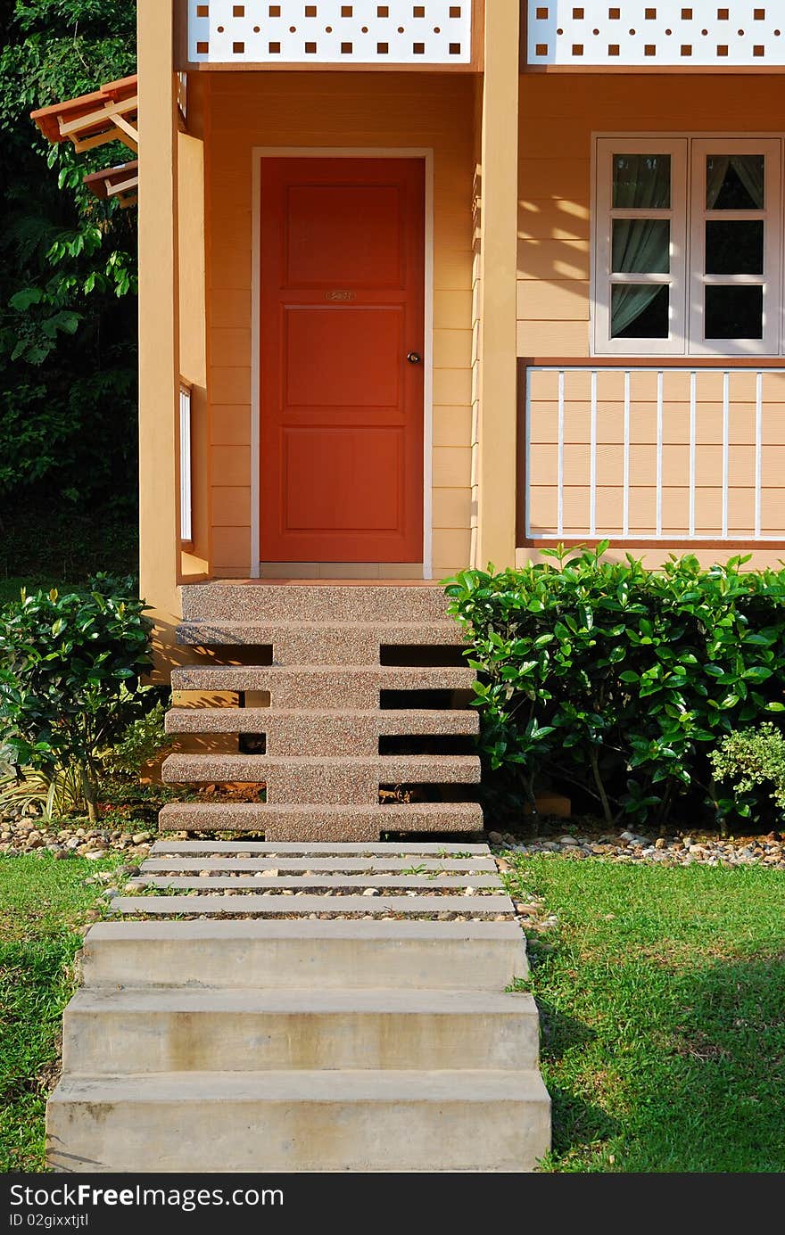 Photo of a house with stairs door and window. Photo of a house with stairs door and window