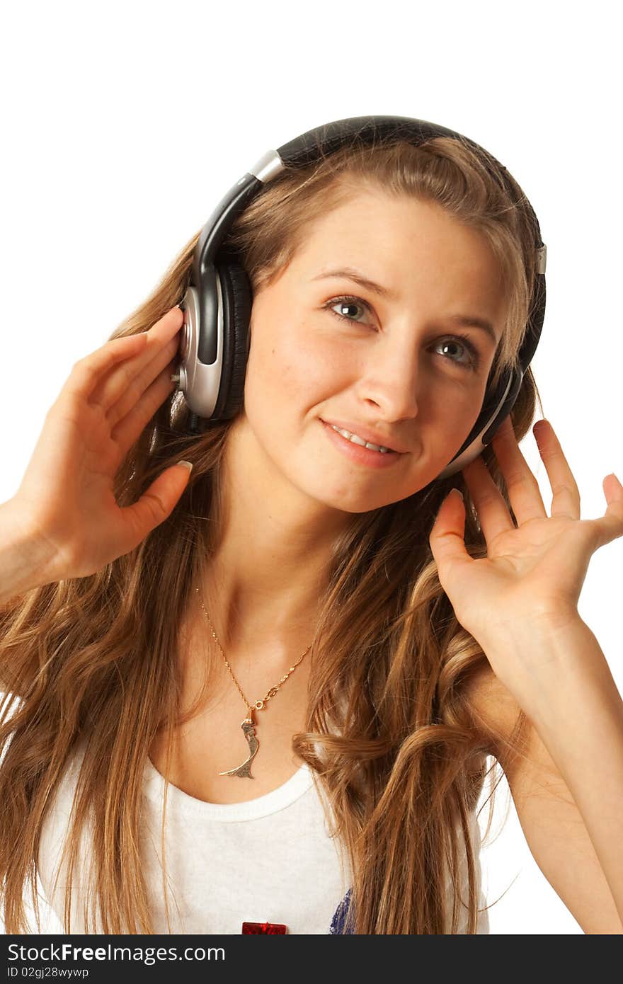 The young beautiful girl with headphones isolated on a white background