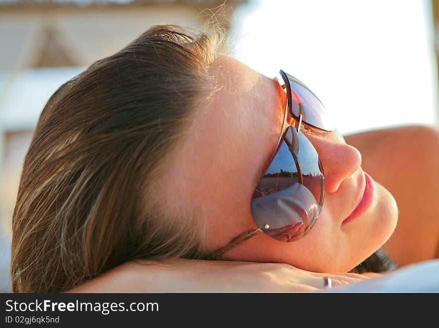 Attractive model resting on the beach